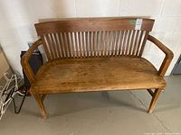 Angled front view showing full bench and slatted back