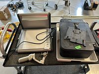 Overview of the lot including the Normlicht Mini 5000 light table, DJI Osmo gimbal, and Canon TS3329 printer on a cart.