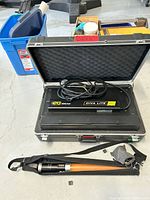 Open aluminum hard case with Kino Flo Diva Lite 401 light unit and power cable inside