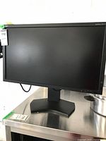 Front view of the NEC MultiSync PA271W monitor on the stand, showing the full screen and base.