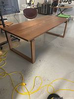 Angled front-side view showing full table and leg design