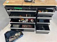 Overall view of Husky tool chest with open drawers showing various tools inside