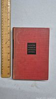 Front cover of the red cloth hardcover book titled 'Selected Papers of Bertrand Russell' with a ruler for size reference.