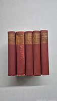 Front view of the 5 red hardcover History of England books showing gold embossed spines.