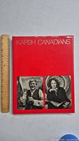 Front cover of the 'Karsh Canadians' book displaying the red dust jacket with white text and two black-and-white portraits.