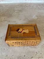Top view of the Japanese secret puzzle box showing inlaid Scottie dogs and decorative border