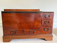 Front and right side view showing five drawers and sliding panel