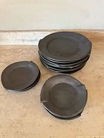 Overview of three stacks showing eight large plates and two stacks of two smaller plates each