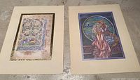 Two vintage Celtic Irish artwork prints by Jim Fitzpatrick with embossed borders, shown side by side on a flat surface.
