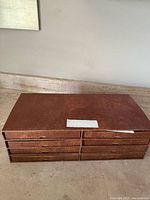 Organizer box with 8 drawers containing the plates