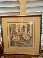 Full view of framed vintage print showing three ballet dancers, Columbine, Harlequin and Violetta, in an outdoor scene with trees.