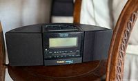 Front view of vintage Timex Indiglo stereo radio alarm clock showing digital display and stereo speakers.