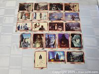 22 vintage Star Wars Empire Strikes Back trading cards arranged in a grid showing various characters and scenes from the movie.