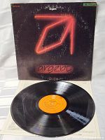 Vinyl LP record of Argent debut album showing orange CBS label and clean, shiny grooves indicating playable condition.