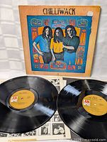 Chilliwack vinyl LP records with yellow A&M labels and black and white insert, laid out on flat surface