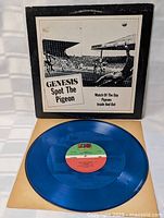Blue translucent vinyl record with Atlantic label, shown outside sleeve