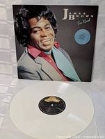 White vinyl LP displaying the black and orange Southbound label, placed in front of the album cover.