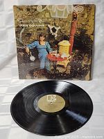 Vinyl record and cover shown together, record black with gold Elektra label visible.