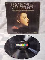 Front cover and vinyl record visible, showing the artwork and Decca label.