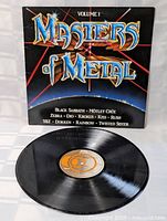 Vinyl record from Masters of Metal Volume 1 laid flat highlighting label and surface condition.
