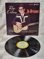 Front and back cover of Roy Orbison In Dreams vinyl LP with the vinyl record displayed below.