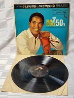 Vinyl LP record with cover and record disc visible, showing cover art with Sam Cooke and label details on vinyl.