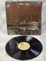 Front of the vinyl record cover for The Beach Boys Holland showing vintage photo design and typical wear.