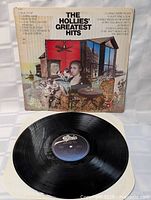 Photo showing the vinyl record on a white surface with visible Epic label and grooves, indicating good condition.