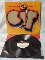 Vinyl LP record and inside sleeve shown outside cover to illustrate vinyl and label condition.