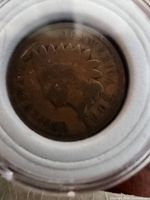 Close-up image of a 1905 Indian Head Penny showing the obverse side with Lady Liberty wearing a Native American headdress, visible date, and worn lettering.