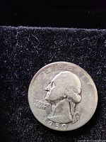 Obverse side of the 1950 silver quarter featuring George Washington profile and inscriptions.