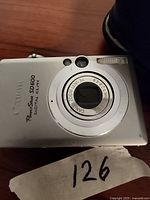 Front view of Canon PowerShot SD600 Digital ELPH camera showing lens and branding.