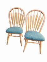 Pair of two wooden dining chairs with curved spindle backs and blue fabric upholstered seats.