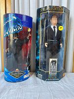 Action figures in original packaging side-by-side, worn boxes visible.