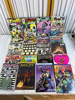 Overview of 16 comic books laid out showing titles including Coyote, Ginger Fox, Death Rattle, Ape City, Breathtaker, Blood and others.