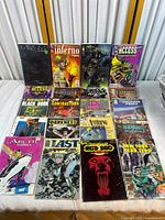 Photo shows a collection of 20 vintage comic books arranged in rows with colorful covers and various publishers' logos.