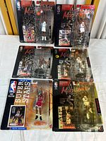 Six unopened Michael Jordan action figures in original packaging, showing condition of boxes and figure details
