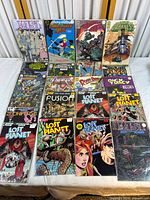 Photo of vintage comic book collection including Lost Planet, American Flagg!, The Light and Darkness War, Avengers, Roger Rabbit