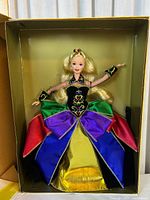 Midnight Princess Barbie doll inside original box showing full doll in colorful gown with jeweled bodice and sleeves, blonde hair with crown