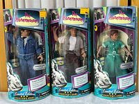 Image of three collector's figures in original packaging showing Ralph Kramden, Ed Norton, and Alice Kramden from The Honeymooners series.