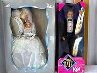 Full front view of boxed Cinderella Barbie doll in wedding dress alongside boxed Great Date Ken doll in tuxedo. Both boxes show signs of aging and some damage.