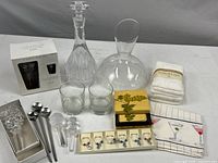 Full lot on display showing two glass carafes, the Home bar set box, coasters, glassware, bar tools, towels, and accessories.