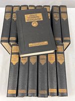 Full set of 15 leather-bound volumes with gold embossed titles showing the book 'Alps Danube Near East' on top.