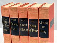 Five volumes of Winston Churchill's The Second World War series shown upright with titles on spines.