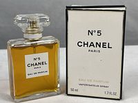 Front view of Chanel No. 5 Eau de Parfum 50 ml 1.7 FL OZ bottle beside the box