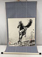 Front view of scroll attached to fabric backing showing horse painting and calligraphy.