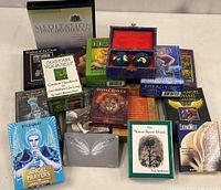 Various meditation and healing card decks, meditation balls in a decorative fabric box, and a Meditation & Psychotherapy CD set arranged on a table.
