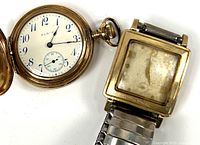 Photo showing both Elgin pocket watch open with visible white dial and blue hands, and Lord Elgin wristwatch with square gold case and metal bracelet.