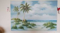 Frontal view of signed canvas print showing two palm trees, grassy sand dunes, ocean and sky.