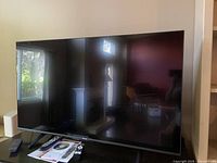 Front view of TV on stand indoors